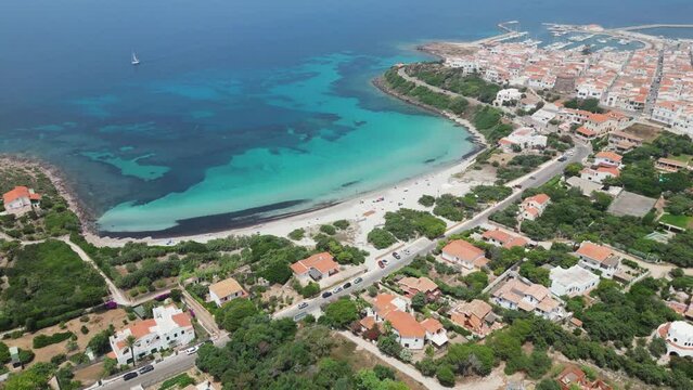 Sotto Torre Beach at Calasetta Beach Town, Sardinia, Italy - 4k Aerial Panning Down