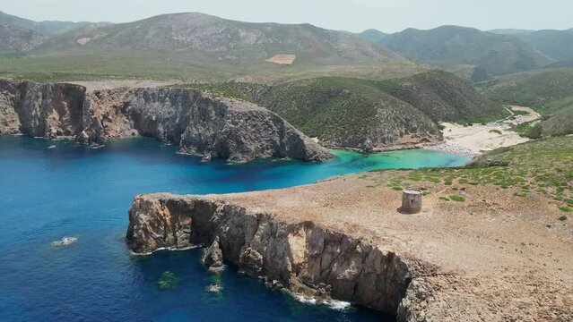Cala Domestica Beach and Blue Cove in Sardinia, Italy - 4k Aerial Circling