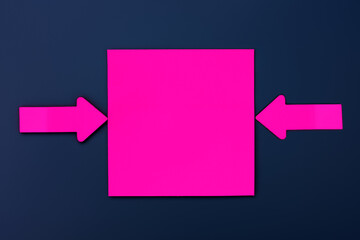 Square sticker. Blank magenta paper note and two colorful arrows over a dark blue background. Image...