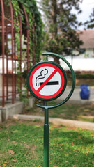 no smoking sign in the park. bokeh background
