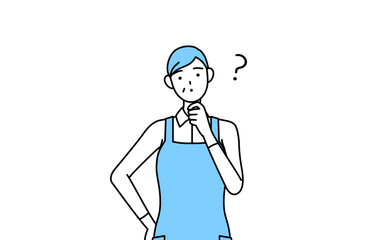 疑問を持つエプロンを着たシニア女性