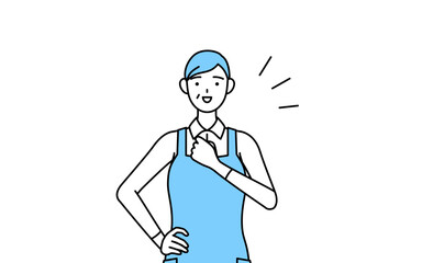 胸を叩くエプロンを着たシニア女性