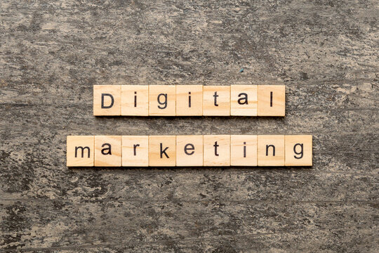 Digital Marketing word written on wood block. Digital Marketing text on cement table for your desing, concept