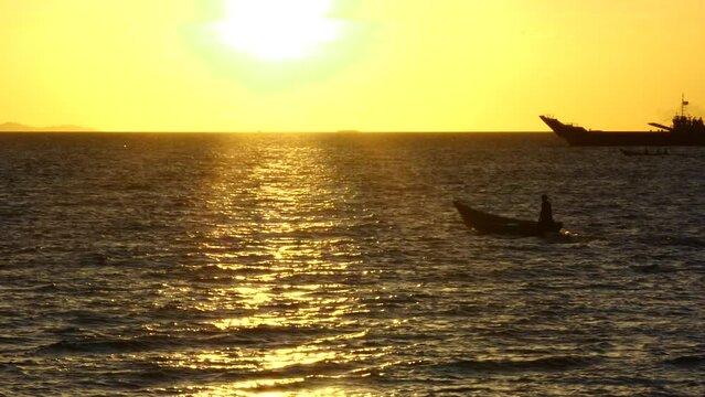 fisherman on their boats indonesia sun set scenery