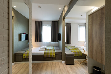Interior of a hotel bedroom with master bed