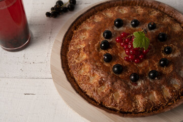 Shortbread pie with black and red currants. Top view, no one.