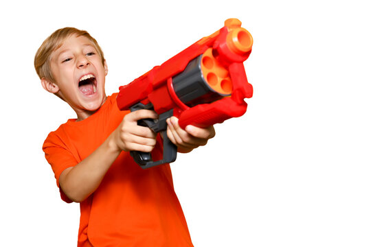 Cheerful boy with a toy gun screams against a transparent background