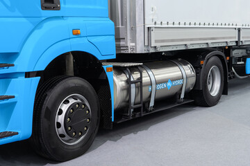 A hydrogen fuel cell semi truck with H2 gas tank onboard. Eco-friendly commercial vehicle concept	