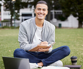 Obraz premium Study, laptop and student portrait in park writing at university, college or campus for research, planning schedule and scholarship. Happy man relax and learning with technology and notebook for exam