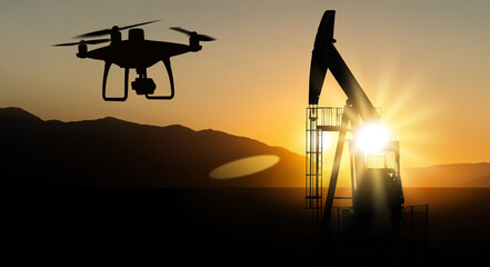 Silhouettes of drone and oil rigs	