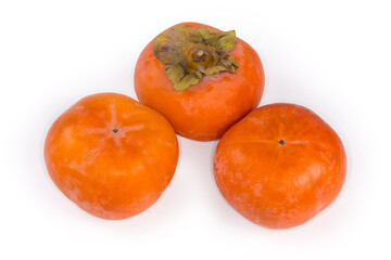 Persimmon fruits close-up on a white background