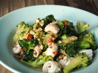 stir fried broccoli and squid with garlic and chili pepper