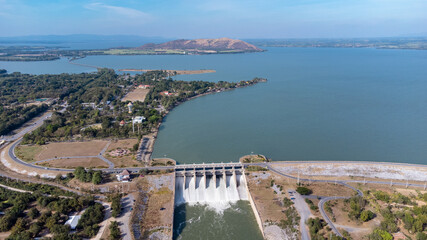 An aerial view over the Pasak Jolasid dam, Lopburi Province, Thailand. Tracking the movement of the floodgates that are releasing water into rural canals in enormous amounts of water.