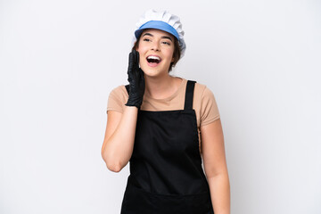 Fishmonger brazilian woman wearing an apron isolated on white background shouting with mouth wide open to the side