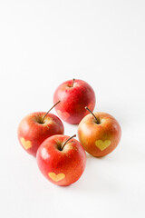 Red apples with a heart symbol