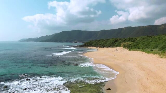 Drone flight over picturesque Amami Beach on tropical island, Japan