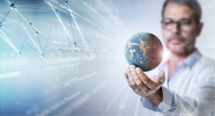 Blurred man holding mid-air earth in his hand. Future in data science and big data analytics business.