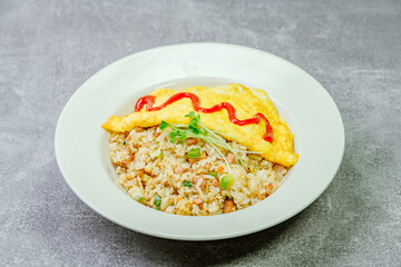 Omelet rice dish served on a white plate