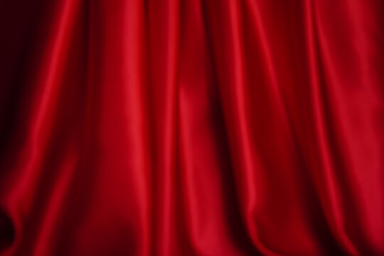 Beautiful wavy bright red curtains close up Blur or Berry