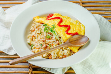Omelet rice dish served on a white plate