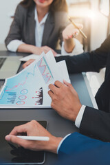 Financial analyst analyzes business people investment consultant analyzing company financial report working with documents graphs. Stock Market Tax Fund Finance concept