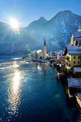 beautiful sunny cityscape of the special city Hallstatt in Austria Salzkammergut snowy winter...