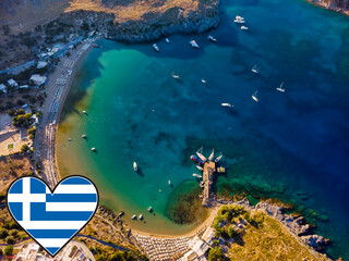 Aerial viev of Lindos Greece, top view of bay with turquise sea water boats and beach and a greece...