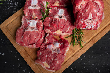 Raw meat, steak on black background