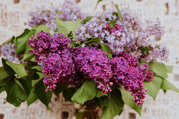 a bouquet of purple lilac in a vase 