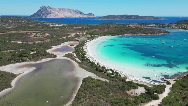 Brandinchi Beach, Salt Lake and Turquoise Blue Bay at San Teodoro, Sardinia - 4k Aerial Forward