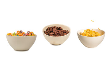 Corn flakes falling to the white bowl. Motion.
