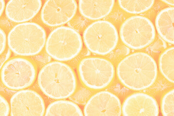 A slices of fresh juicy yellow lemons.  Texture background, pattern