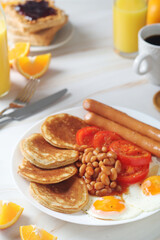 Traditional British breakfast with sausages and beans