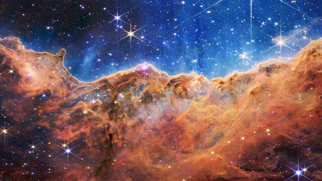 Cosmic Cliffs in the Carina Nebula. James Webb Space Telescope. Glittering Landscape of Star Birth. Elements of this image furnished by NASA.