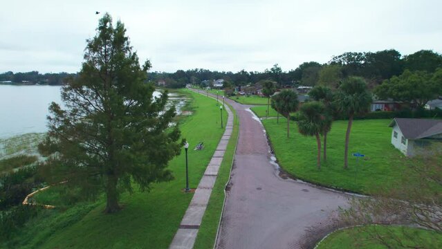 Aerial flyover of the Starke Lake and the charming and quaint city of Ocoee, Florida and Starke Lake.  Ocoee is a family oriented town with restaurants, breweries, bars, and shopping.