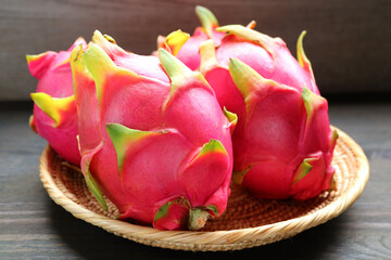 Heap of Fresh Ripe Vibrant Pink Dragon Fruits in a Basket