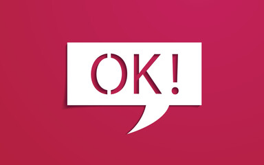Word OK on paper cut speech bubble.