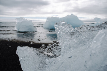 Chunks of ice washed up by the sea lie on the black beach of Breidamerkursandur ( Diamond Beach). They come from the broken icebergs from the glacier lagoon Jökulsárlón, which migrate into the sea.