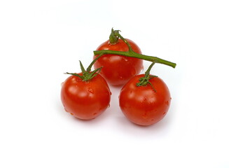 Bunch of fresh, red tomatoes with green stems isolated on white background. Clipping path.