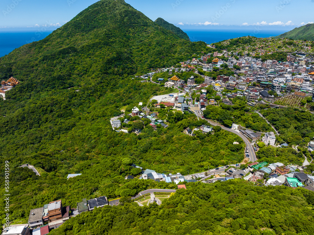 Wall mural Drone fly over Taiwan Jiufen village on the mountain