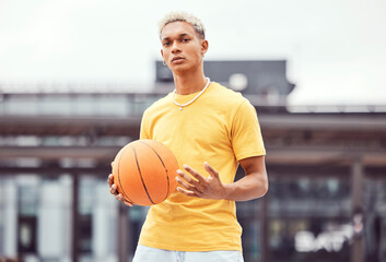 Basketball, young man and basketball player with sport in park with portrait in city and exercise...