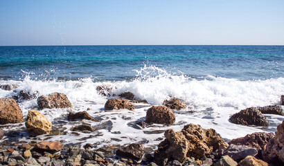 Fototapeta na wymiar Sea view landscape, rocks and splash of waves