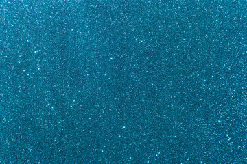 Background with sparkles. Backdrop with glitter. Shiny textured surface. Dark cyan