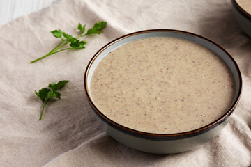 Homemade Cream of Mushroom Soup in a Bowl, side view.