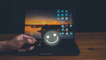 Customer service and Satisfaction concept, Business people holding magnifying glass with happy Smiley face icon to searching for satisfaction in service. rating very impressed.
