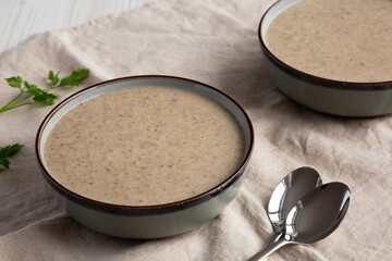 Homemade Cream of Mushroom Soup in a Bowl, side view.