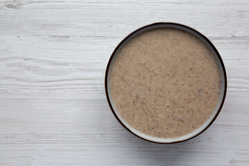 Homemade Cream of Mushroom Soup in a Bowl, top view. Flat lay, overhead, from above.