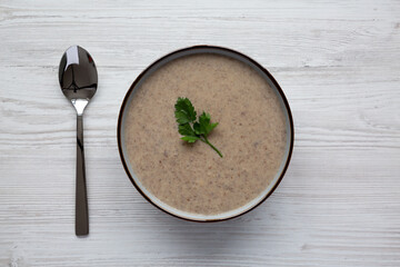 Homemade Cream of Mushroom Soup in a Bowl, top view. Flat lay, overhead, from above.