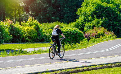 Cyclist ride on the bike path in the city Park
