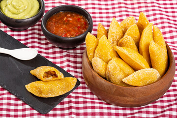 Colombian Empanada With Spicy Sauce And Guacamole.